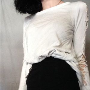 White sweater,ribbon design on side of sleeve